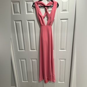 NBD pink gown with deep neckline and criss cross back.